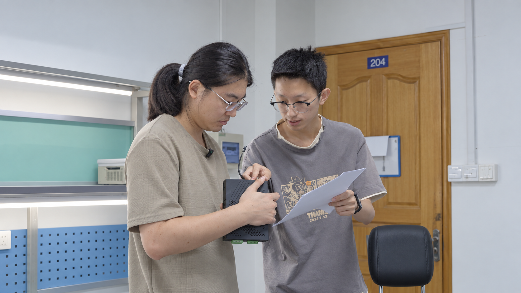 Engineers configuring control and hardware